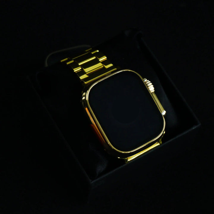UniWatch 8 Ultra 24K Gold Edition smartwatch with illuminated Apple logo on display, featuring a luxurious gold strap in a black box.